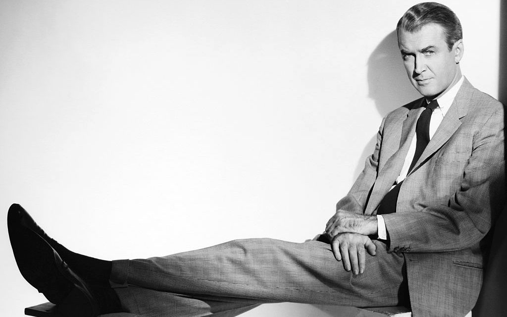 Stewart leaning up against a wall 