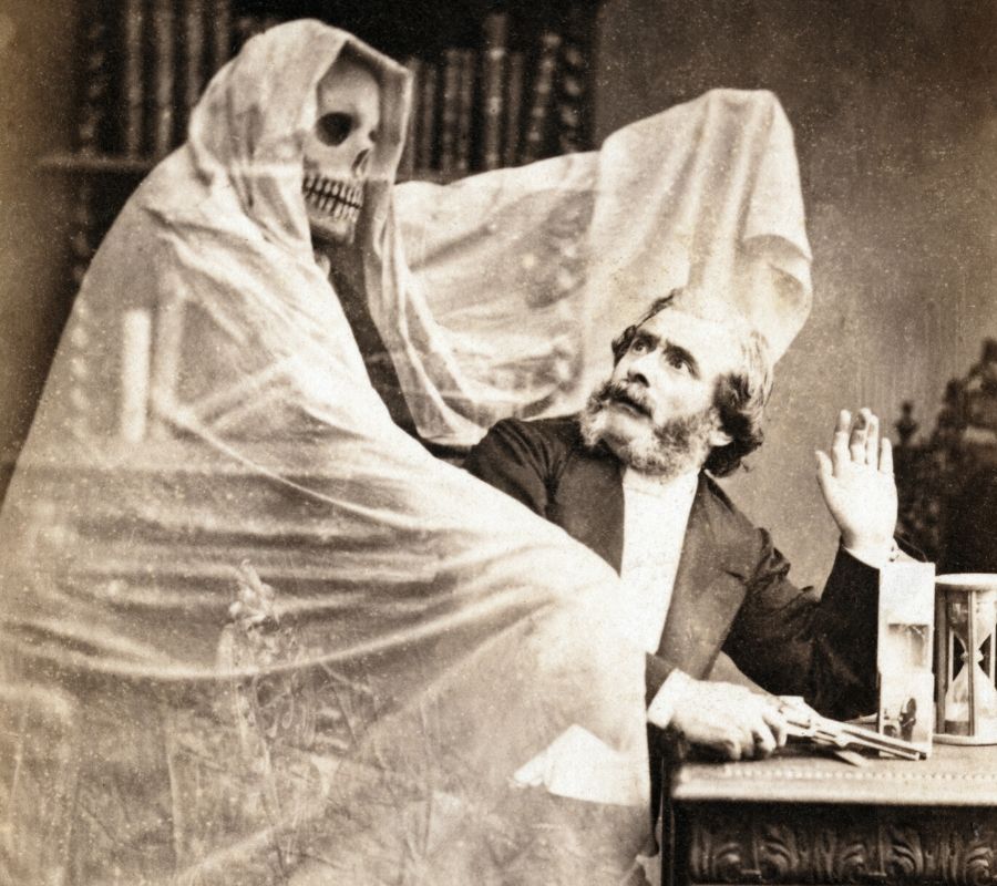 a man with a ghost behind him