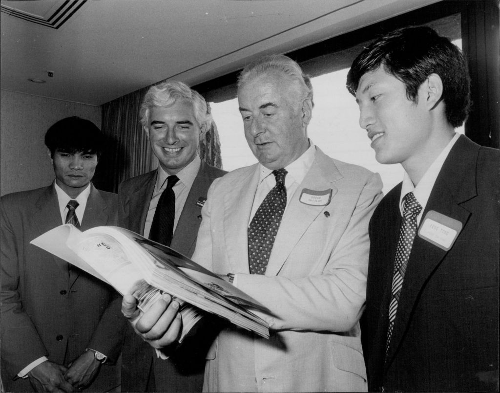 Men looking at book