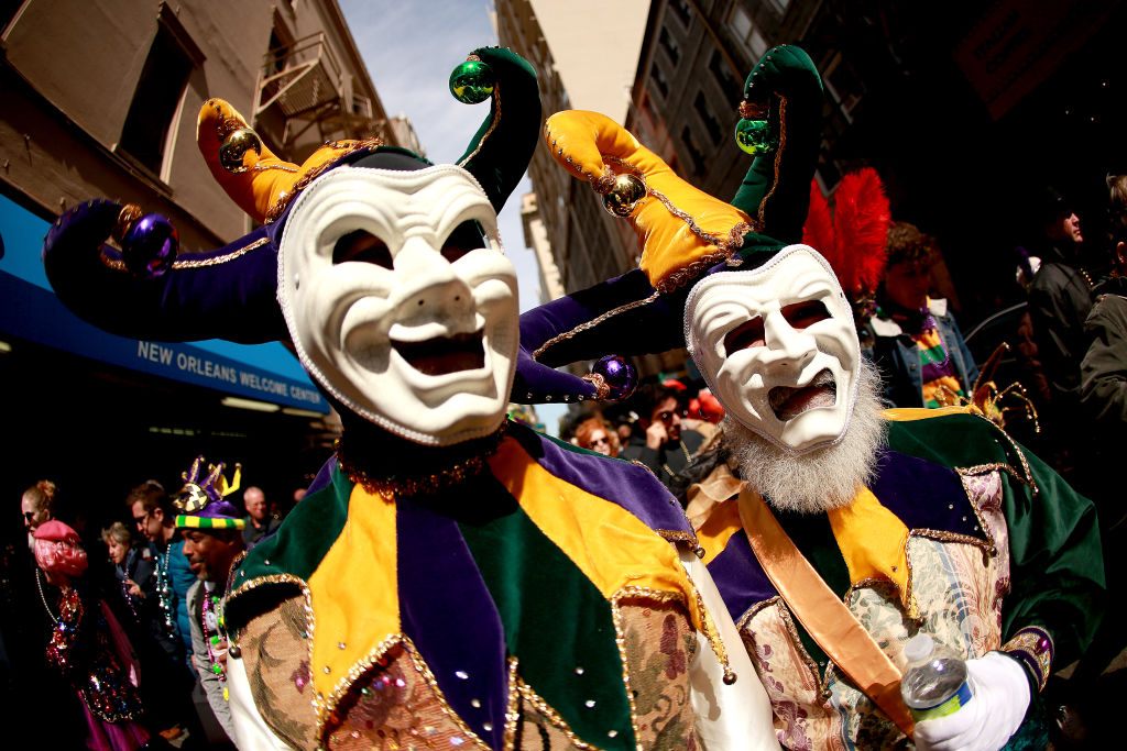 Revelers in creepy masks