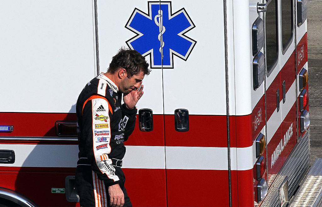 Sadler in front of ambulance