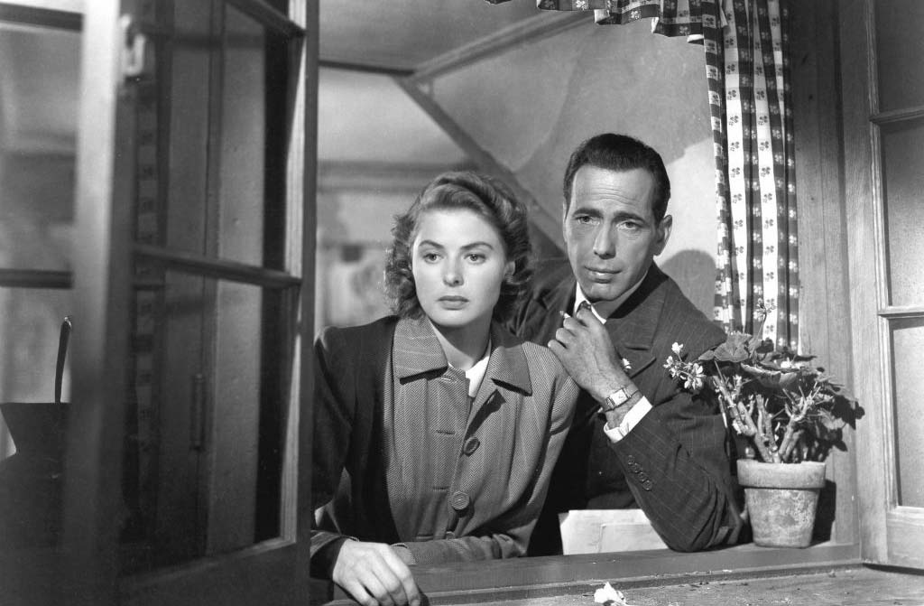 Ingrid Bergman and Humphrey Bogart looking out of window 