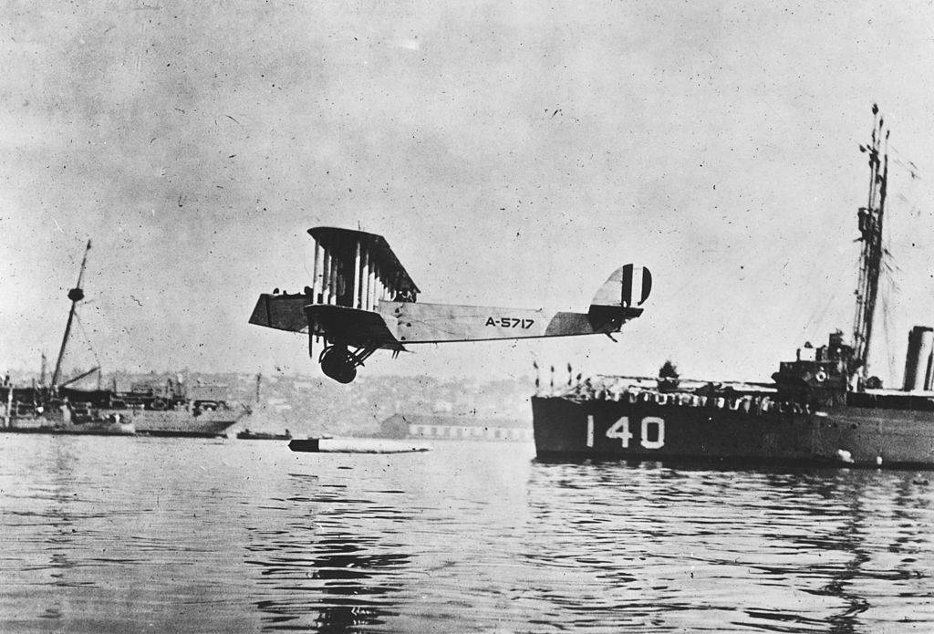 Plane flying over water 