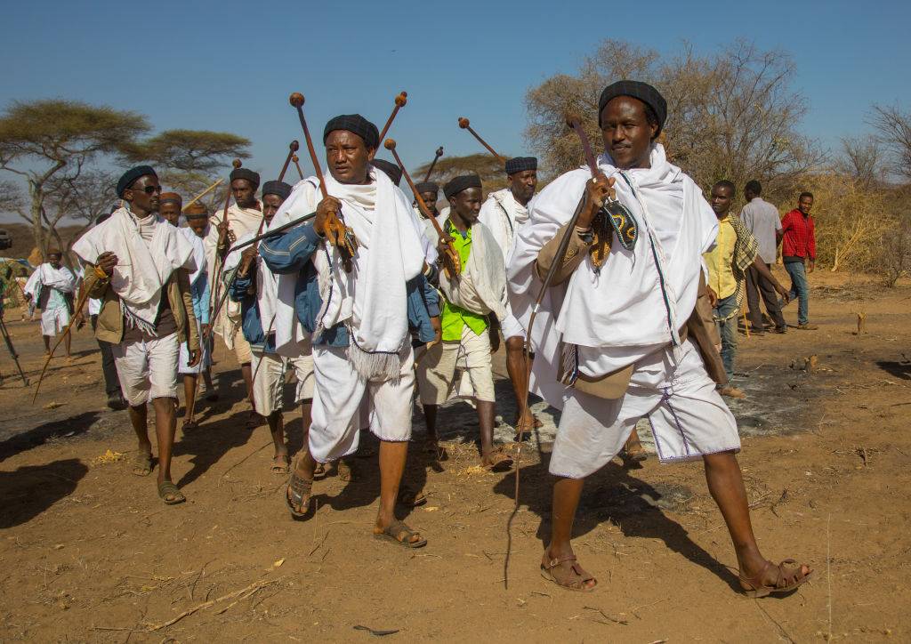 Men in white clothes 