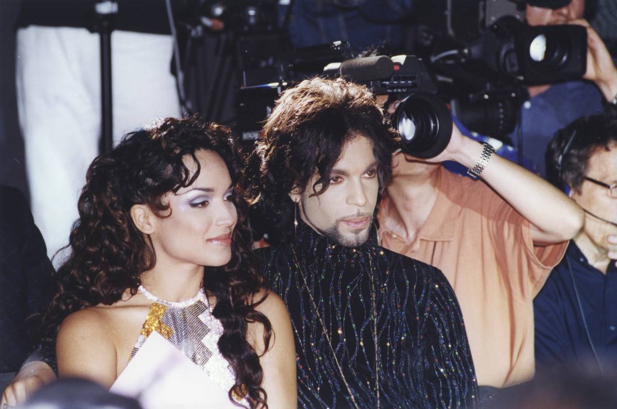 Prince and Mayte Garcia get interviewed by paparazzi.