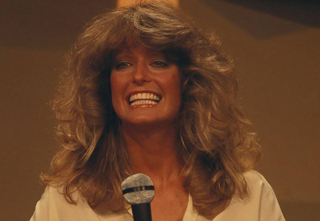 Fawcett with a microphone