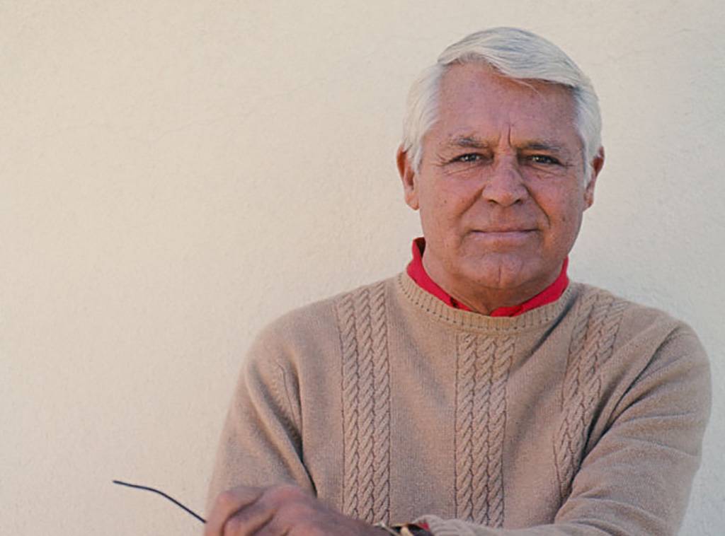 Cary Grant in a sweater and red shirt 