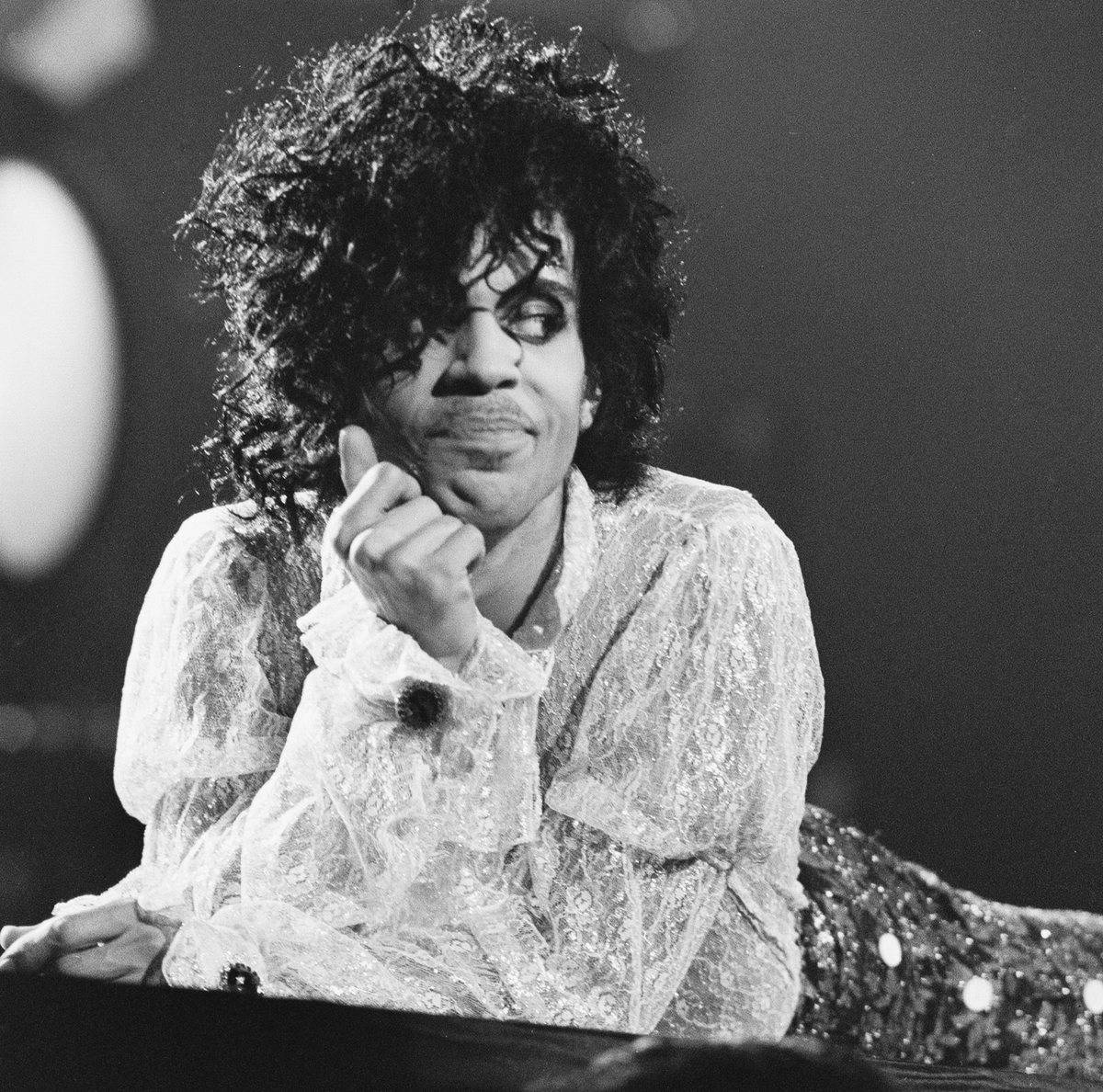 Prince lies down while onstage.