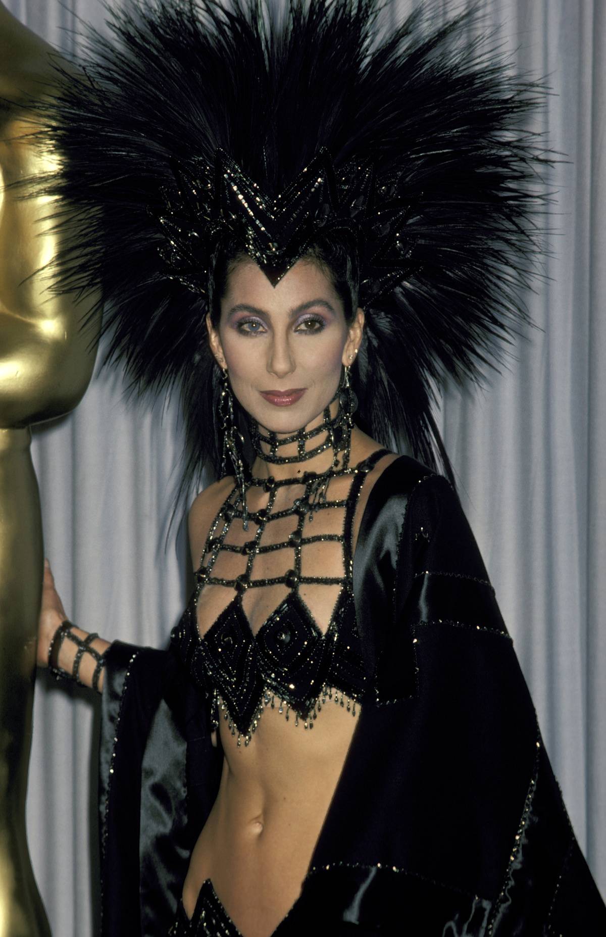 Cher wears a poofy, black wig to an event.