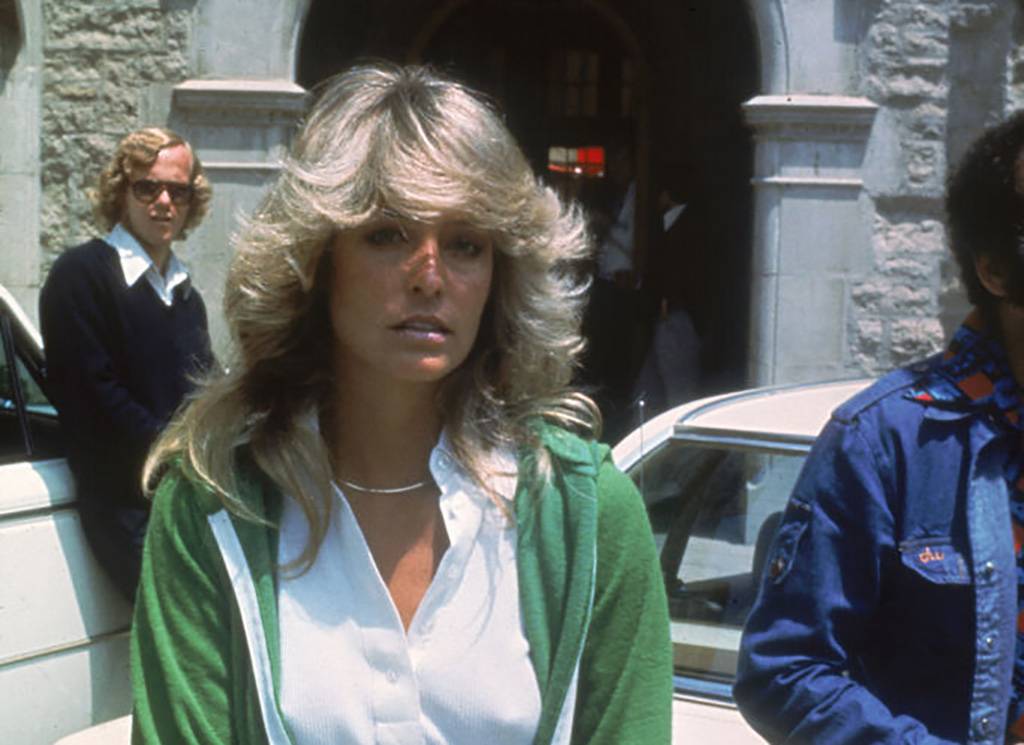 Fawcett in a green sweater