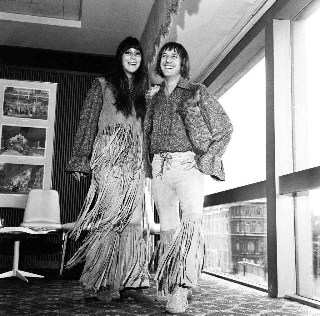 Sher and Sonny wear matching fringe outfits.