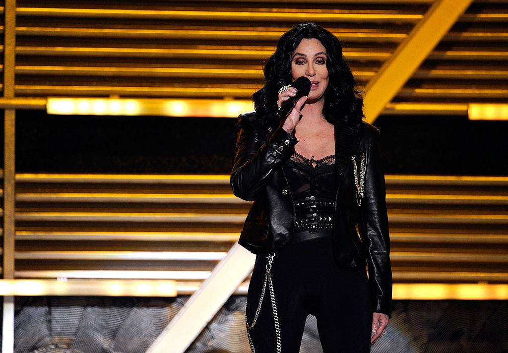 Cher speaks onstage at the Country Music Awards.