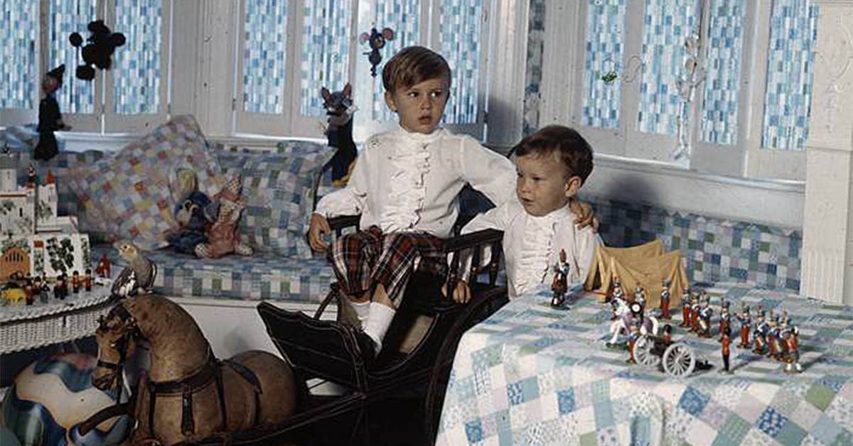 cooper with his brother in their childhood mansion