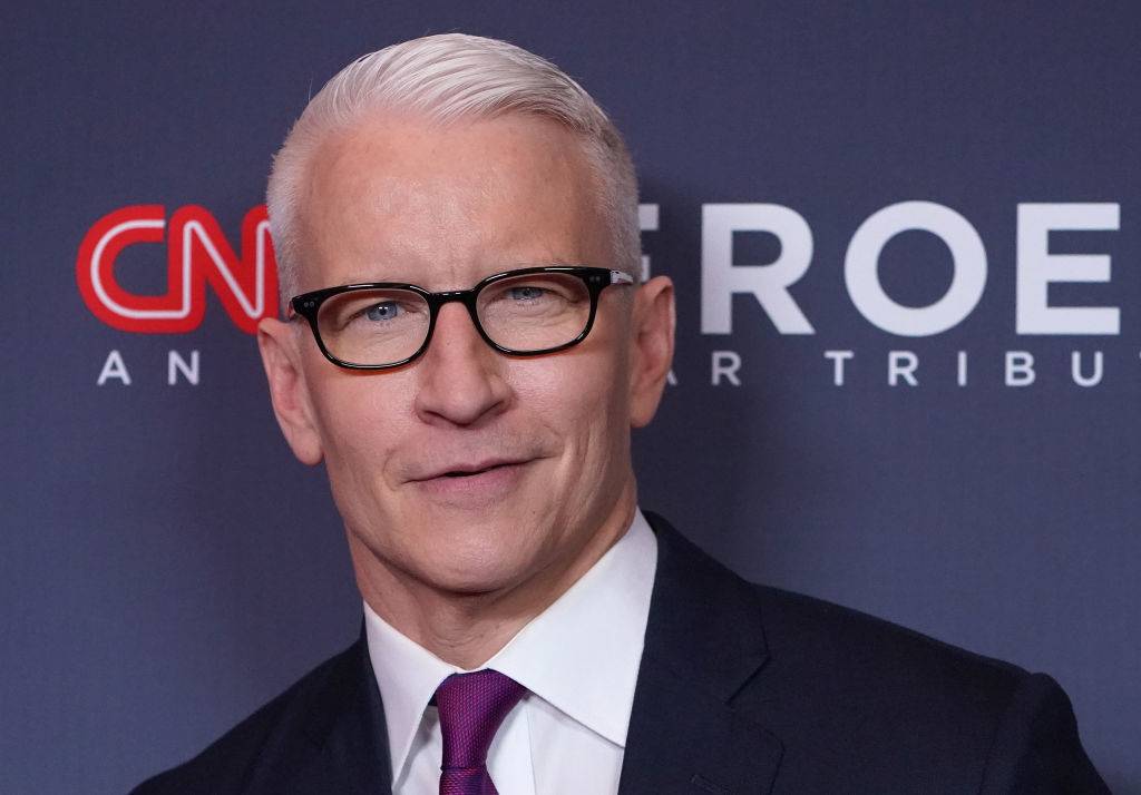 cooper wearing glasses on a red carpet