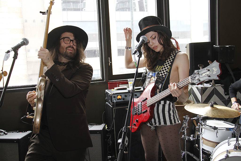Sean and Charlotte play guitar together.