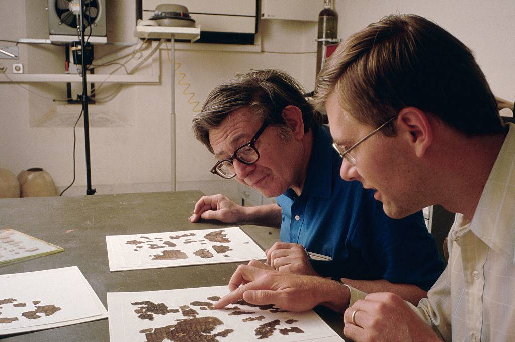 Men looking at fragments 