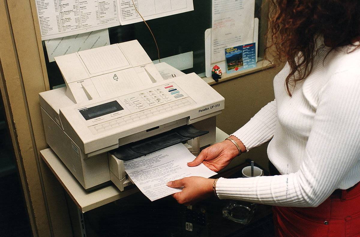 Fax Machines Live To Collect Dust And Cobwebs