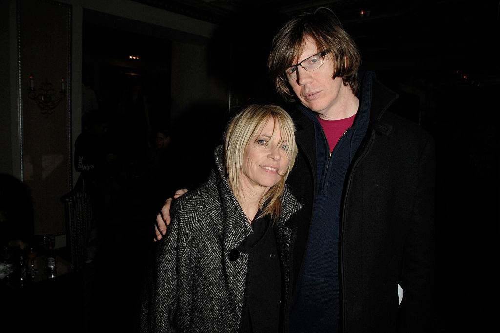 Kim and Thurston pose outside at night.
