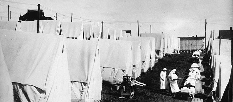 nurses outside of canvas tents