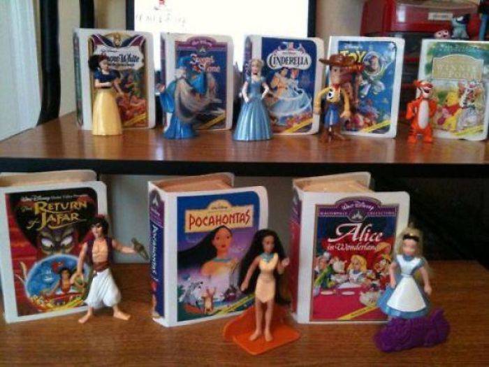 disney VCR tapes with princess figurines