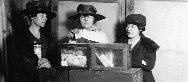 three women wearing hats