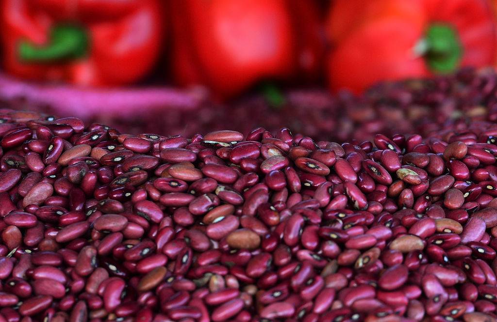 Kidney beans and sweet red peppers are sold at a fruit and vegetable market in Tegucigalpa