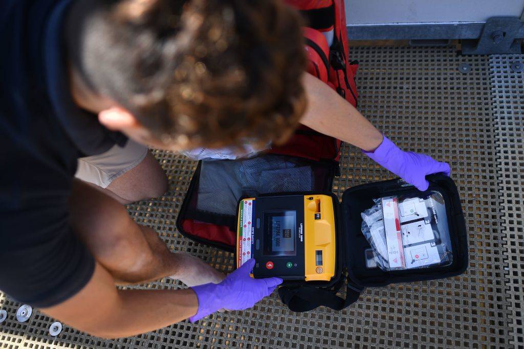 am Woodard checks a defibrillator as he prepares a lifeguard station on the beach at Viking Bay in Broadstairs, south-east England, on May 28, 2020