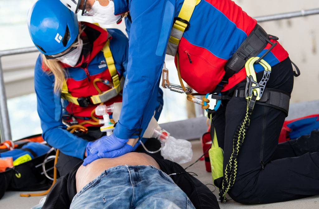 Members of the mountain rescue service take part in an exercise in the mountain rescue training centre and simulate the resuscitation of a person.