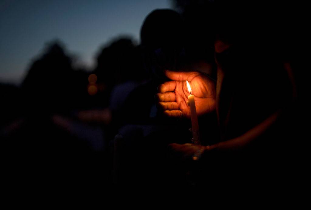 People attend a candle light vigil in memory of George Floyd and others who were killed by police on June 7, 2020 in Minneapolis, Minnesota.