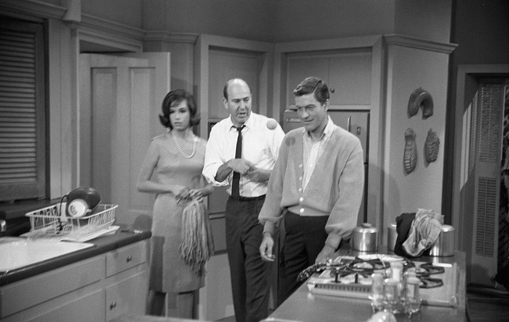 Actors Dick Van Dyke and Mary Tyler Moore with writer, producer, director and actor Carl Reiner in rehearsal for The Dick Van Dyke Show
