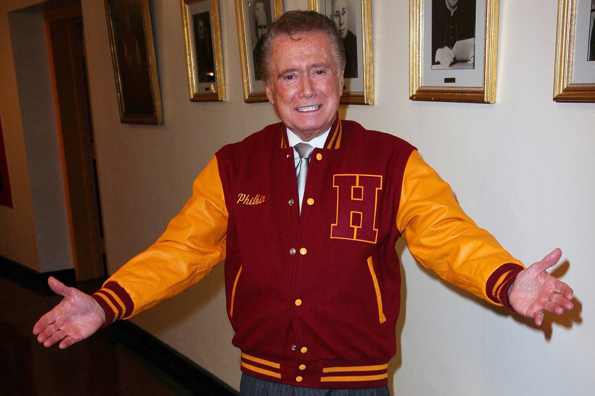 Regis Philbin stands in the Regis Philbin Cardinal Hayes High School Auditorium.