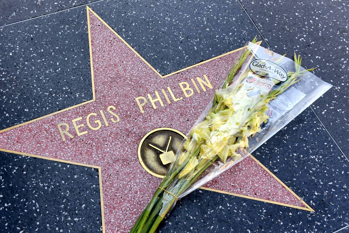 Flowers are placed on television host Regis Philbin's star on the Hollywood Walk of Fame.