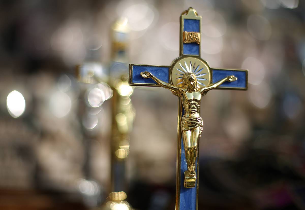 Crucifixes are displayed for sale near Vatican City