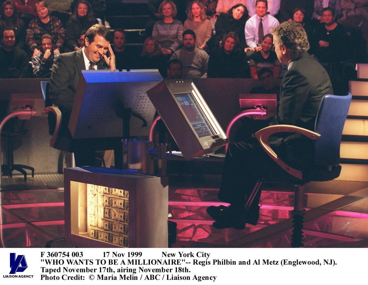 Regis Philbin quizzes a contestant on Who Wants to Be a Millionaire.