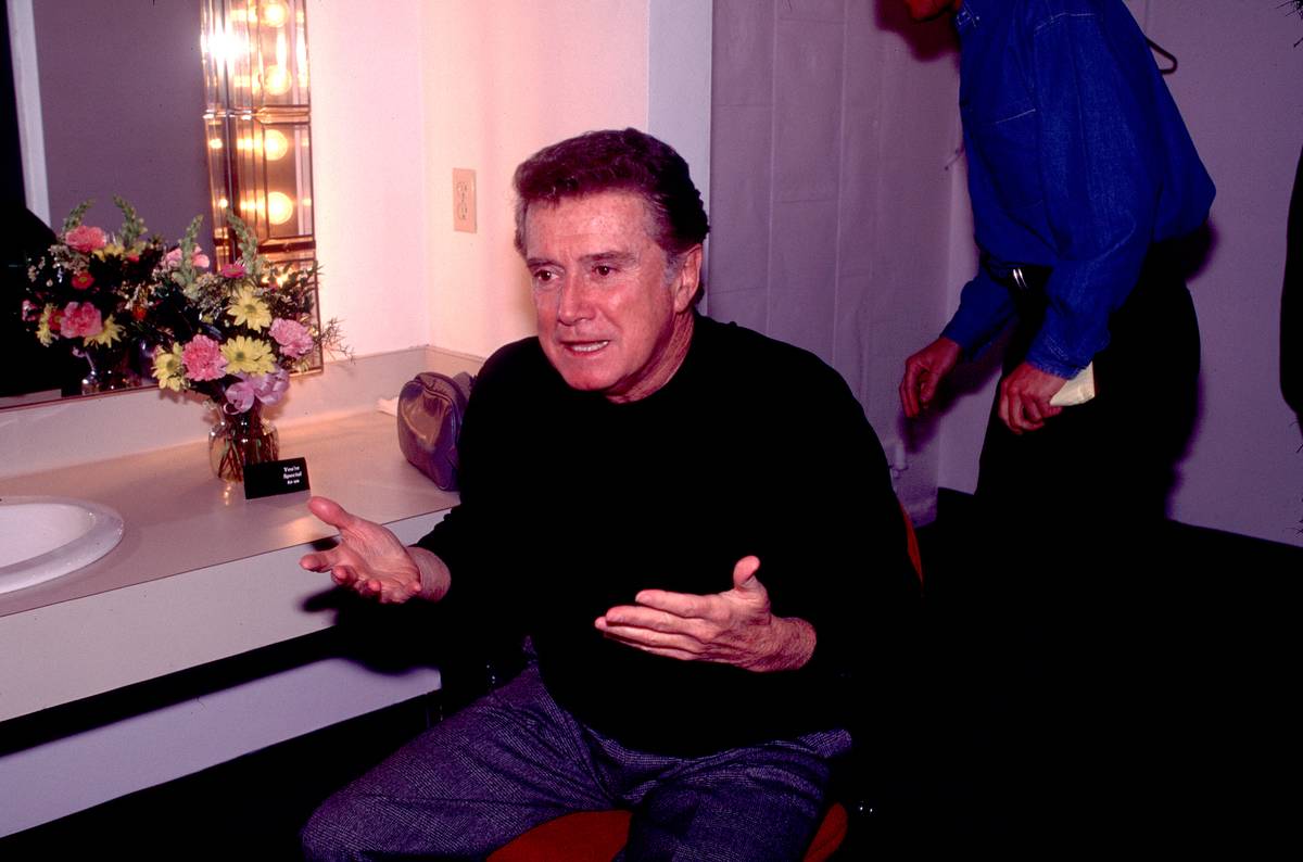 Regis Philbin sits backstage.