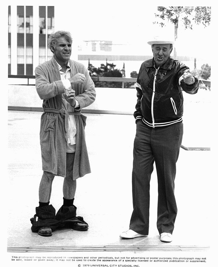 Steve Martin with pants down stands with director Carl Reiner in a scene from the film 'The Jerk', 1979.