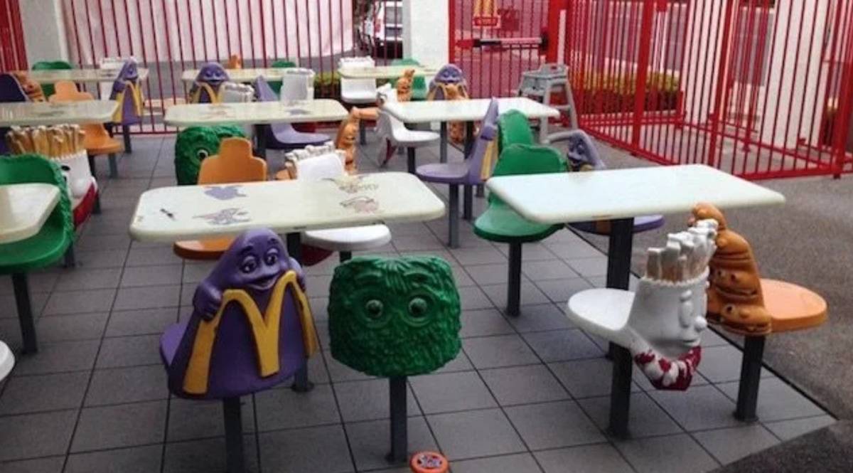 seats in children's play area are shaped like mascot team members