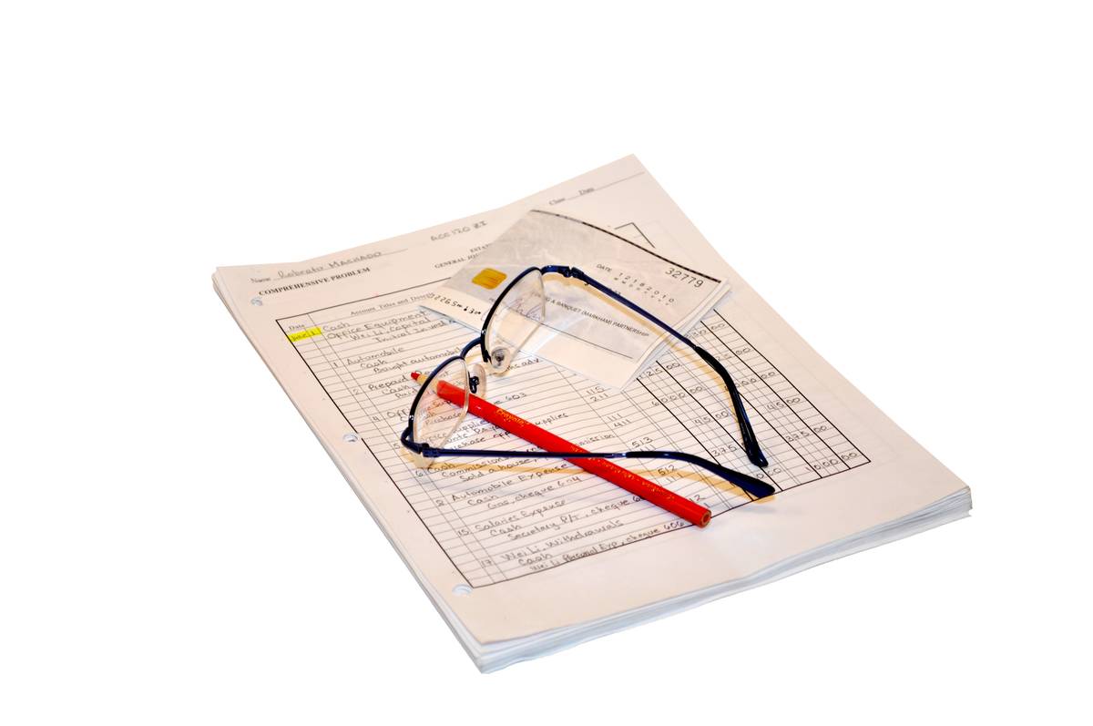 Accounting sheets with solved problem: Eyeglasses, red...