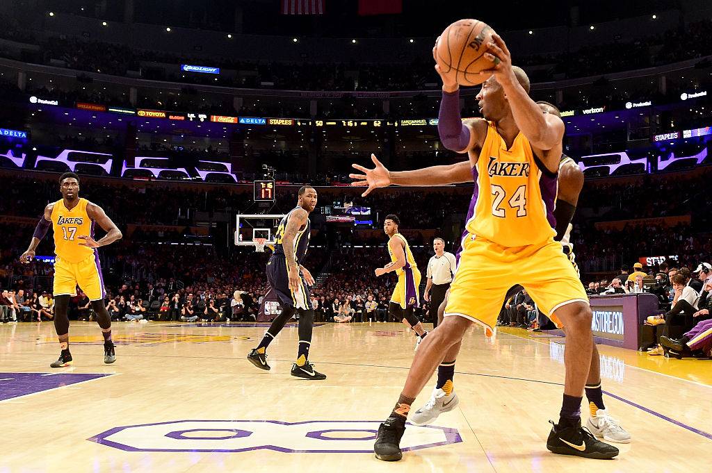 Kobe Bryant #24 of the Los Angeles Lakers with the ball against the Utah Jazz