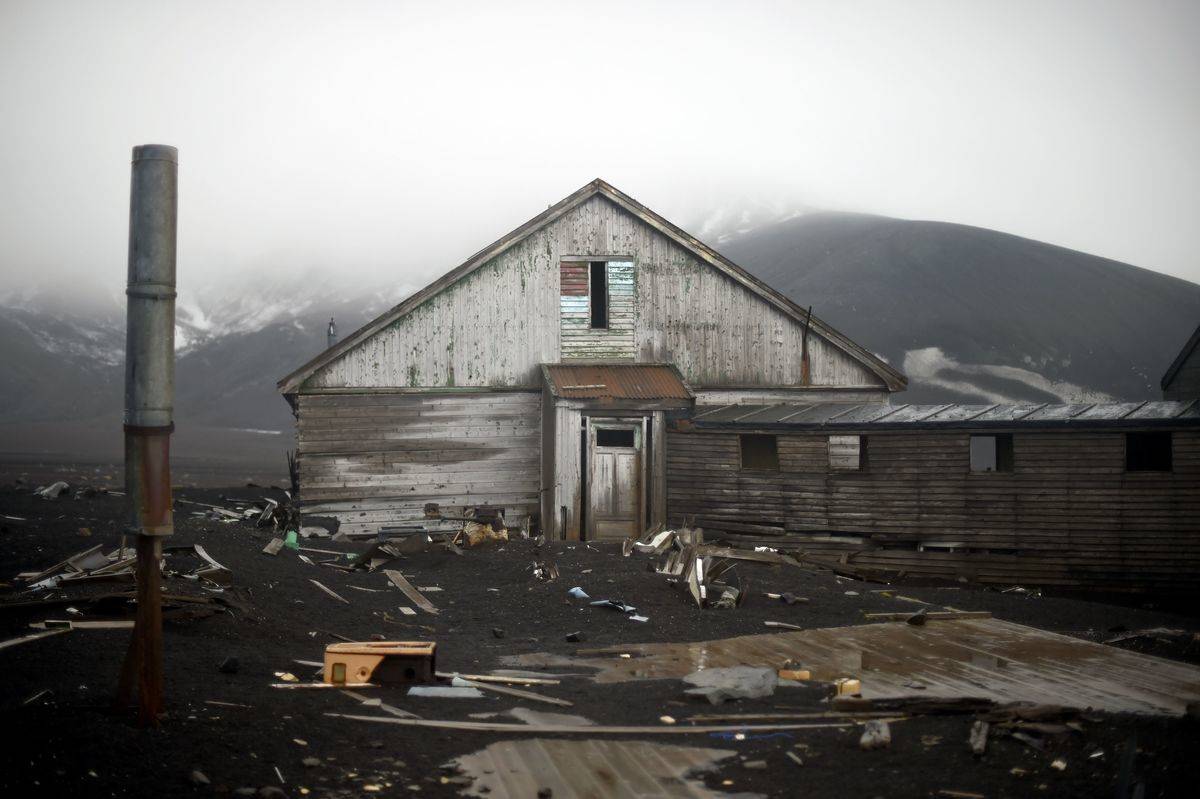 An old building of a British shipping base, which was consumed by a mudslide sparked by a volcano, crumbles at Whalers Bay in Deception Island