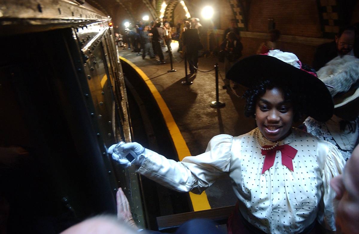 New York City Metropolitan Transportation Authority (MTA) volunteers wearing period customs usher guests to historic City Hall Subway Station.