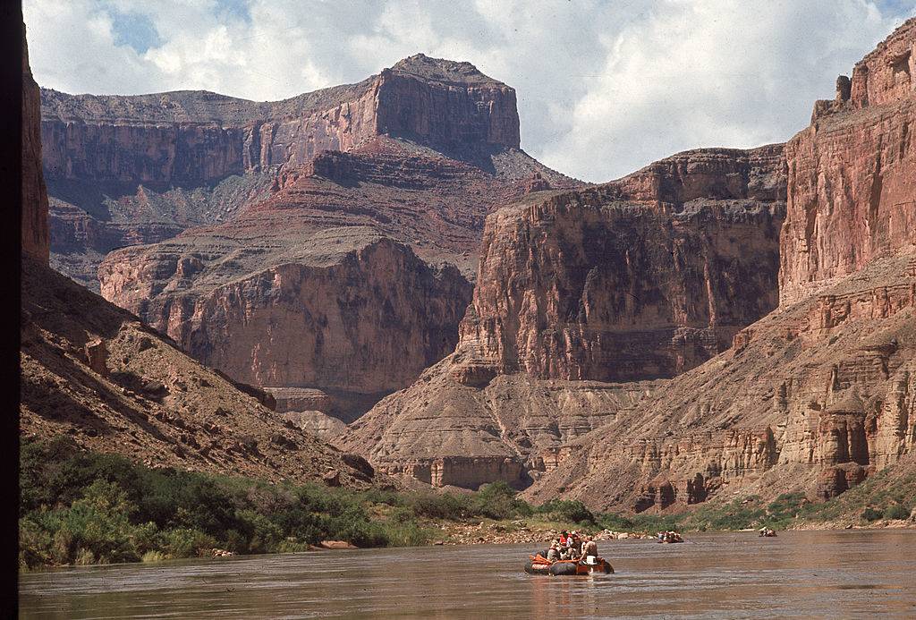 People paddling down the river