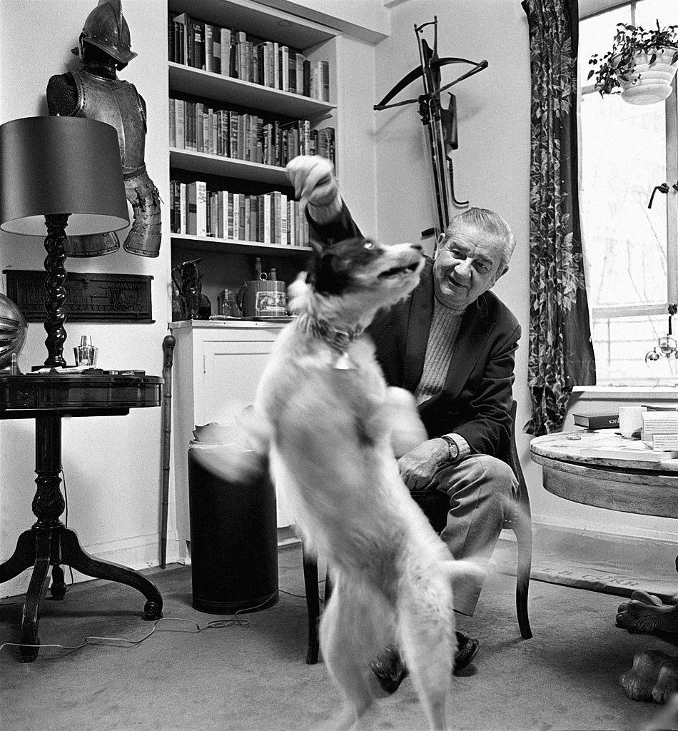 charles addams playing with his dog