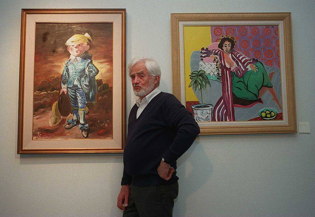 hank ketcham posing with a dennis the menace painting
