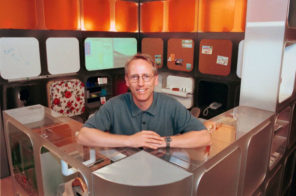 scott adams sitting at a cubicle