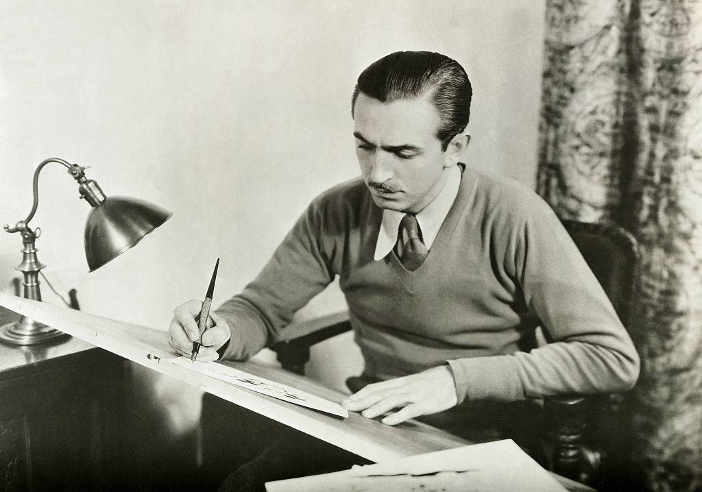walt disney at his drawing board