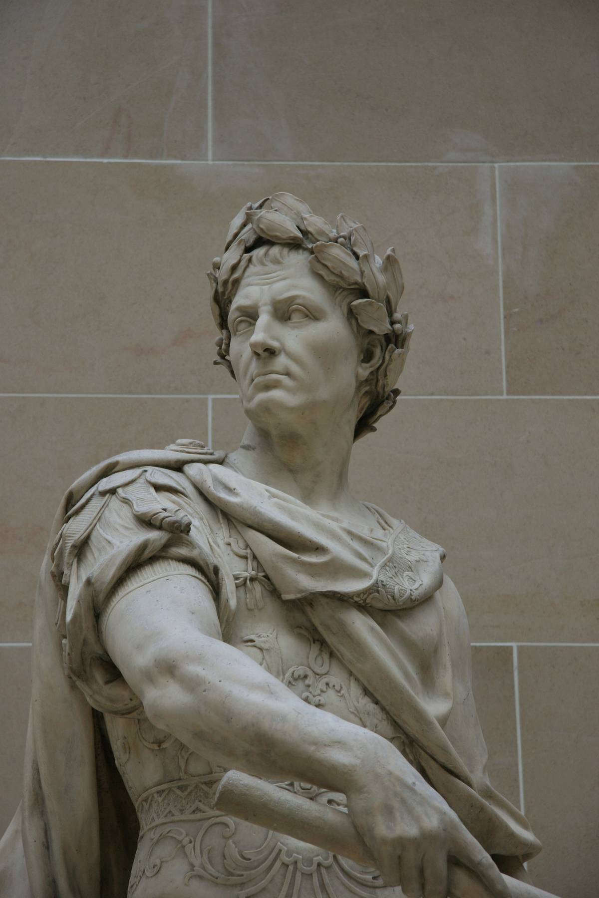 A statue of Julius Caesar by Nicolas Coustou shows him wearing a crown of laurels.