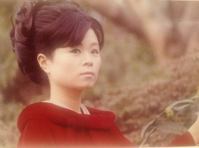 Picture of woman in red coat taken in 1966