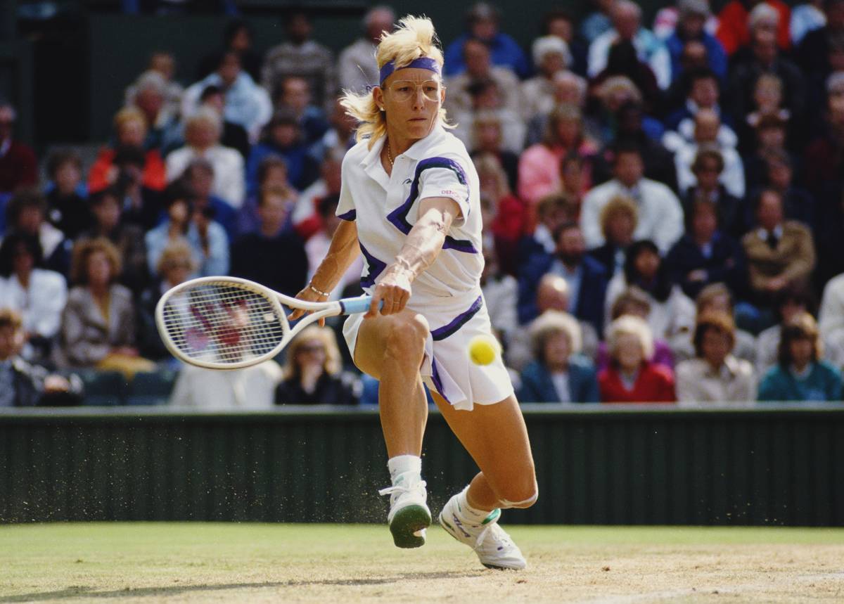 Martina Navratilova stretches to make a backhand.