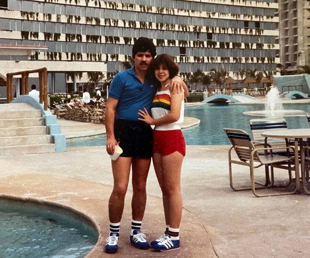couple standing by pool